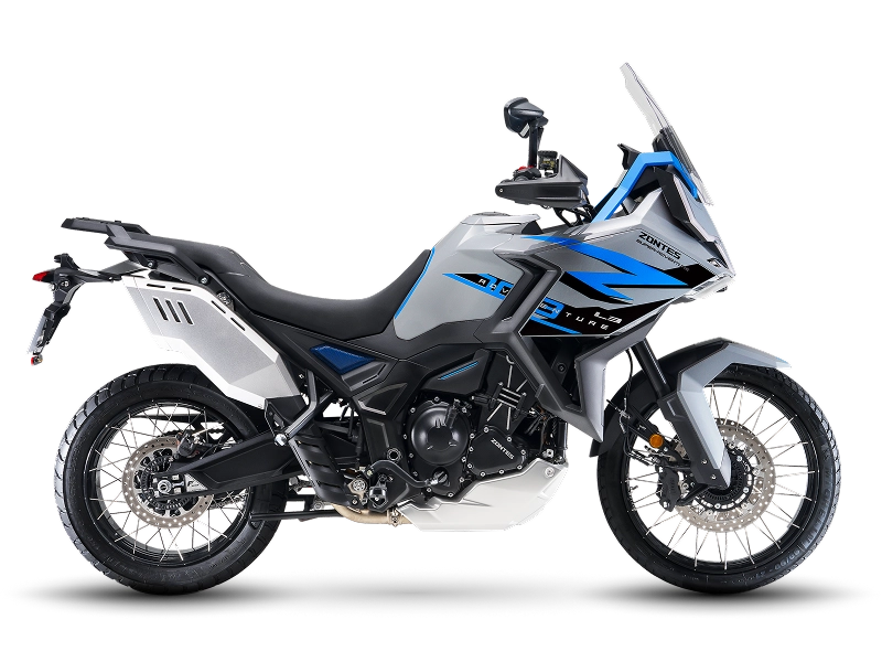 Zontes motos en Uruguay - Moto Zontes 703F con diseño adventure y combinación de gris, blanco y azul. Zontes motos en Uruguay - Zontes 703F en color gris, blanco y azul con parabrisas alto, ruedas de rayos y perfil adventure.